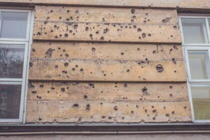 Bullet marks on the wall of the house