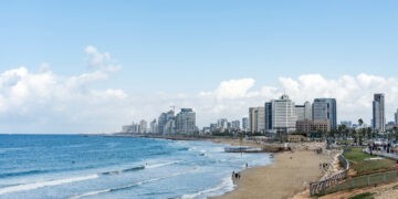 Seascape and skyscrapers on background in Tel Aviv, Israel